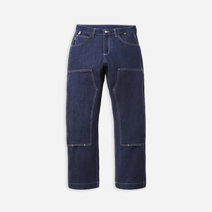 Danner - Danner Kenton Double Knee Pant Dark Indigo - Dark indigo blue denim work pants with large front cargo pockets and contrast light stitching, shown flat against a light gray background. - Main Front View