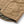 Load image into Gallery viewer, Close-up of a tan quilted jacket with a large front patch pocket, zipper closure, and a small metal brand tag, shown on a white background.
