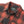 Load image into Gallery viewer, Close-up of a collared button-front shirt jacket in a red and dark gray/black plaid pattern, with a visible neck label reading Denim.
