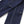 Load image into Gallery viewer, Close-up of dark indigo denim fabric with white contrast stitching, showing part of a pocket and seam detail on a white background.

