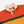 Load image into Gallery viewer, Drake's Block Stripe Knitted Rugby - Red, Yellow &amp; Purple
