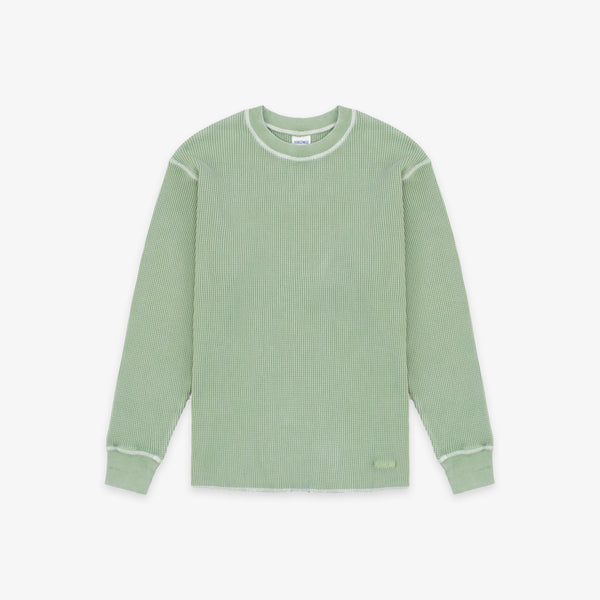 A sage green ribbed knit long-sleeve shirt with contrasting light green trim along the crew neck, shoulders, cuffs, and hem, displayed flat against a light gray background.