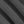 Load image into Gallery viewer, A close-up of dark charcoal gray knit fabric with soft diagonal folds showing the woven texture.
