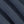 Load image into Gallery viewer, A close-up of dark navy blue textured fabric with soft diagonal folds showing the woven material detail.
