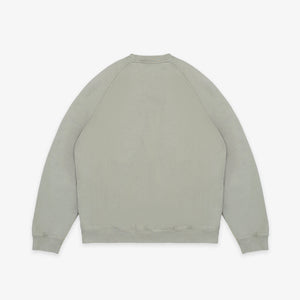 Dubbleware - Dubbleware Vintage Dye Sweatshirt - Washed Green - A light sage green crewneck sweatshirt shown from the back, laid flat against a clean white background. - Alternative View 1