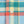 Load image into Gallery viewer, Close-up of a plaid fabric with a light-colored four-hole button, showing intersecting stripes of teal, light blue, yellow, and coral red.
