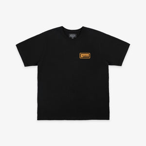 Pendleton - Pendleton Patch T-Shirt - Dark Grey - A black short-sleeve crewneck t-shirt with a small orange rectangular logo patch on the left chest, displayed flat against a light gray background. - Main Front View