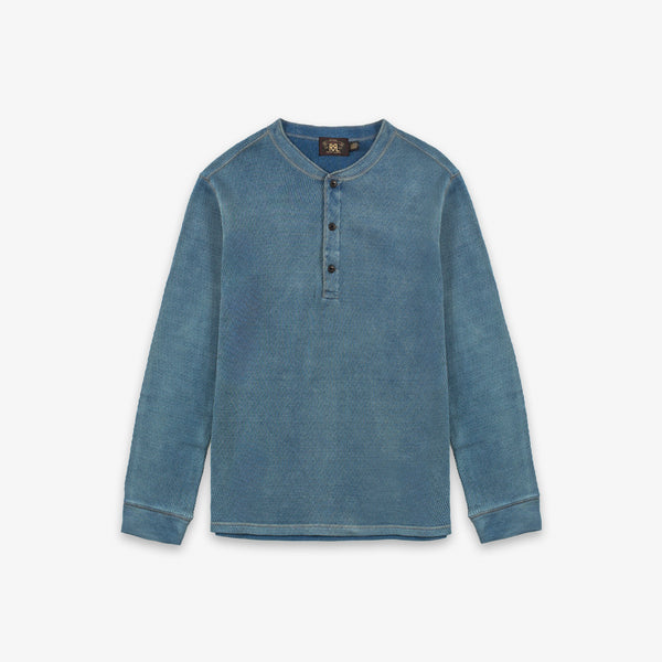 A blue long-sleeve henley shirt with a three-button placket, displayed flat against a light gray background.