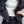 Load image into Gallery viewer, Close-up of a person wearing a dark navy jacket over a white shirt and dark navy pants, with the jacket open to show the interior lining and zipper details.
