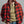 Load image into Gallery viewer, A man wearing a red and black buffalo plaid flannel shirt over a muted olive green henley shirt, paired with blue jeans, against a neutral gray studio background.
