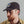 Load image into Gallery viewer, A man wearing a dark brown baseball cap with a circular embroidered patch featuring an eagle and stars, paired with a tan button-up shirt against a plain gray background.
